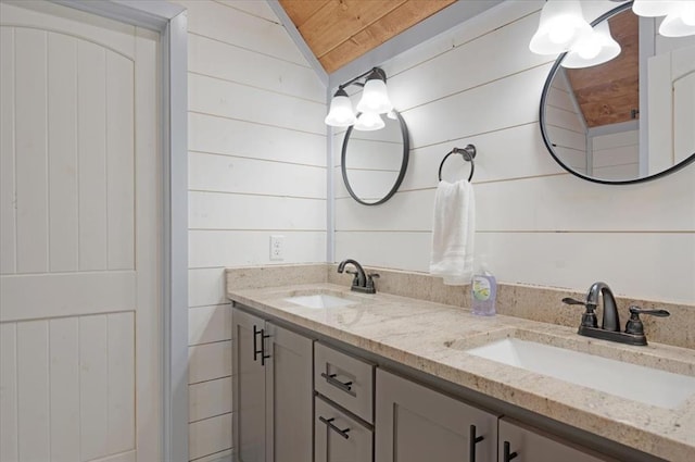 203 Secluded Cir, Broken Bow, OK 74728 - bathroom with double vanity, wooden ceiling, wood walls, and vaulted ceiling