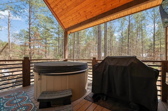 203 Secluded Cir, Broken Bow, OK 74728 - wooden terrace with a hot tub and area for grilling