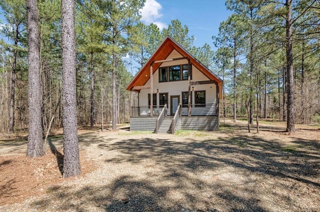 203 Secluded Cir, Broken Bow, OK 74728 - rustic home featuring stairway and covered porch