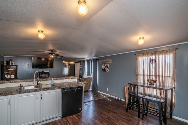 kitchen with a sink, dark wood-style flooring, baseboards, a ceiling fan, and dishwasher