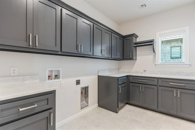 15632 Flora Ave, Edmond, OK 73013 - laundry room featuring cabinet space, hookup for a washing machine, electric dryer hookup, and baseboards