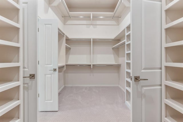 15632 Flora Ave, Edmond, OK 73013 - walk in closet with carpet floors