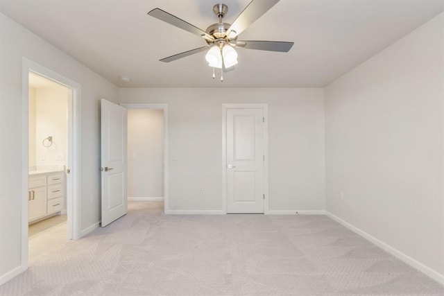 15632 Flora Ave, Edmond, OK 73013 - unfurnished bedroom with light carpet, baseboards, and ceiling fan
