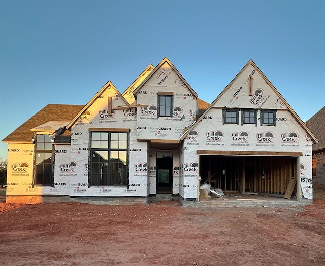 15705 Flora Ave, Edmond, OK 73013 - unfinished property with driveway and an attached garage