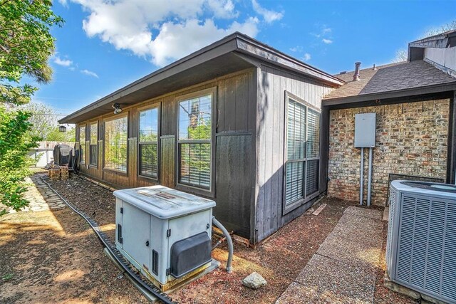 view of home's exterior with cooling unit