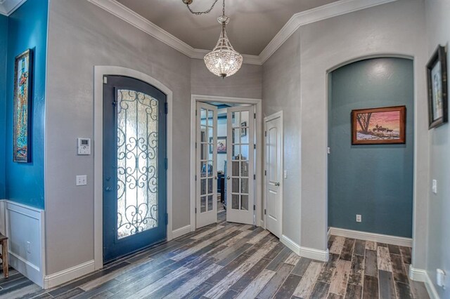 393 Haloka Ave, Washington, OK 73093 - entrance foyer featuring baseboards, ornamental molding, wood finished floors, an inviting chandelier, and french doors
