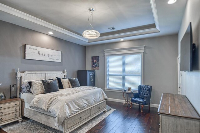 393 Haloka Ave, Washington, OK 73093 - bedroom featuring crown molding, baseboards, a raised ceiling, dark wood-style floors, and visible vents