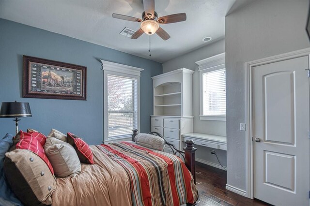 393 Haloka Ave, Washington, OK 73093 - bedroom featuring baseboards, visible vents, ceiling fan, and dark wood-style flooring