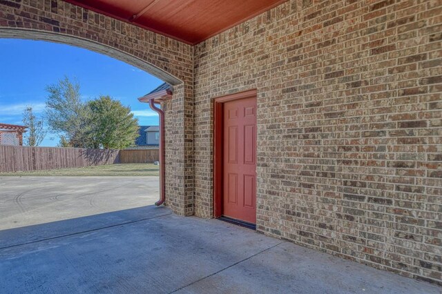 393 Haloka Ave, Washington, OK 73093 - entrance to property with fence, a patio area, and brick siding