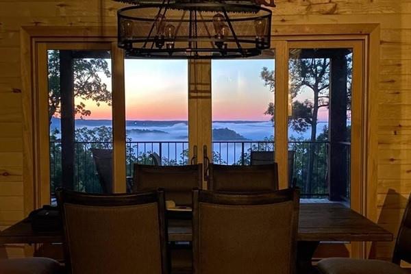 357 Little Creek Ln, Broken Bow, OK 74728 - dining room featuring a water view and a chandelier