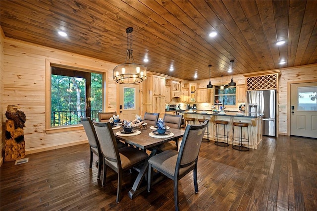 357 Little Creek Ln, Broken Bow, OK 74728 - dining space with visible vents, wood walls, dark wood-type flooring, wooden ceiling, and a notable chandelier
