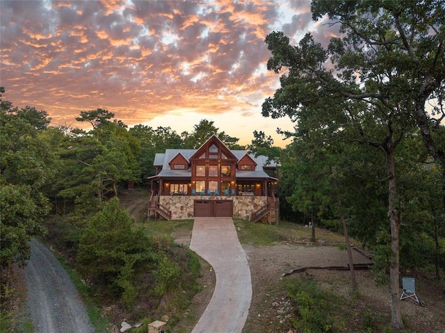 357 Little Creek Ln, Broken Bow, OK 74728 - chalet / cabin with stone siding, driveway, a garage, and stairs