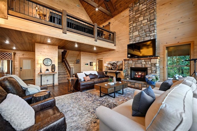 357 Little Creek Ln, Broken Bow, OK 74728 - living area featuring wood walls, stairway, wood ceiling, beam ceiling, and wood finished floors