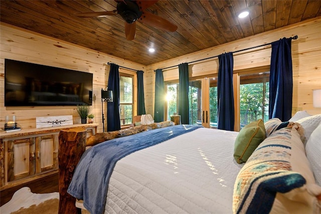 357 Little Creek Ln, Broken Bow, OK 74728 - bedroom with multiple windows, wooden walls, and wooden ceiling