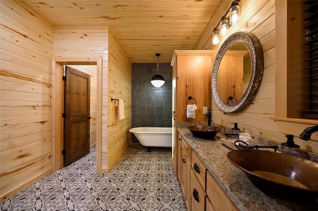 357 Little Creek Ln, Broken Bow, OK 74728 - full bath featuring a freestanding bath, a sink, wooden ceiling, and wooden walls