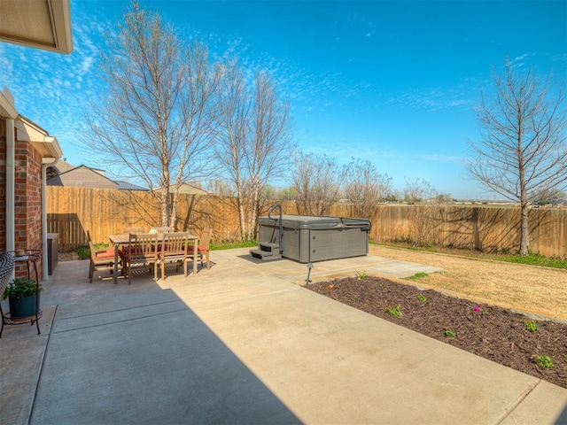 4604 Mccann Ave, Mustang, OK 73064 - view of patio / terrace featuring a hot tub, outdoor dining area, and a fenced backyard