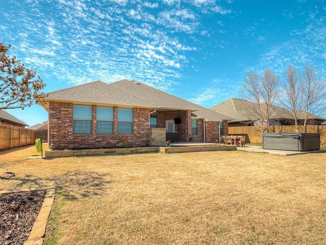4604 Mccann Ave, Mustang, OK 73064 - rear view of property with a hot tub, a patio, brick siding, and a shingled roof