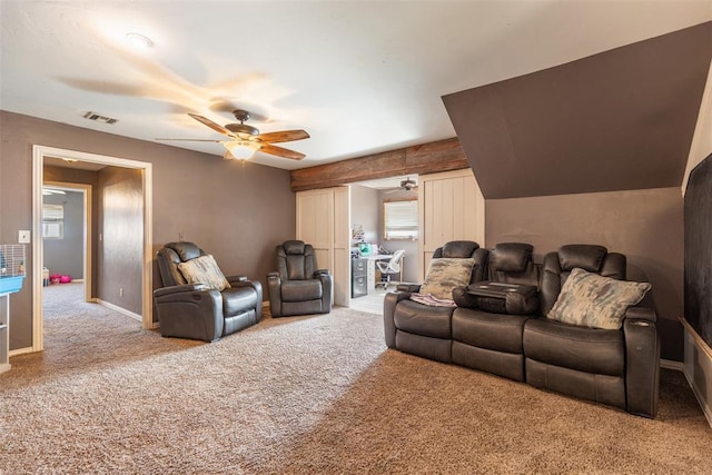 carpeted cinema room featuring baseboards, visible vents, and ceiling fan