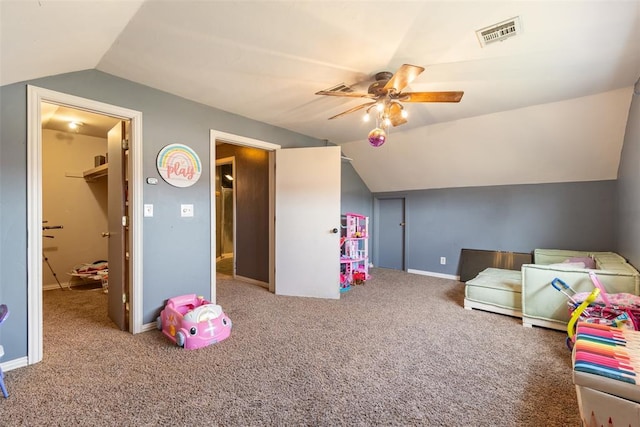 carpeted bedroom with baseboards, visible vents, lofted ceiling, and a ceiling fan