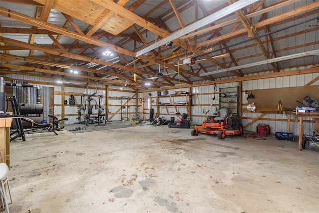 garage featuring metal wall and a garage door opener