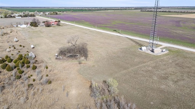 birds eye view of property with a rural view