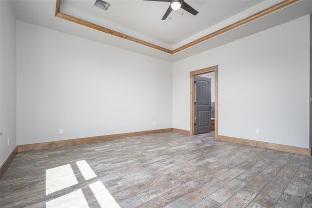 1430 County St Unit 2977, Blanchard, OK 73010 - unfurnished room with a tray ceiling, a ceiling fan, and wood finished floors