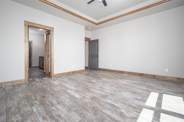 1430 County St Unit 2977, Blanchard, OK 73010 - spare room featuring wood finished floors, ceiling fan, and a tray ceiling