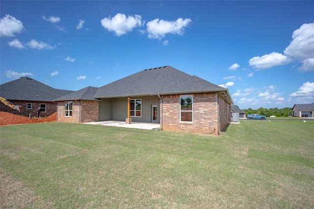 1430 County St Unit 2977, Blanchard, OK 73010 - back of property featuring a patio area, a yard, board and batten siding, brick siding, and a shingled roof