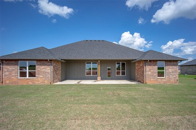1430 County St Unit 2977, Blanchard, OK 73010 - back of property with a patio area, brick siding, a yard, and a shingled roof
