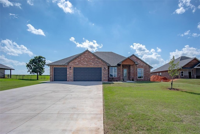 1430 County St Unit 2977, Blanchard, OK 73010 - view of front of house with an attached garage, driveway, and brick siding