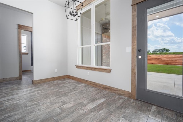 1430 County St Unit 2977, Blanchard, OK 73010 - unfurnished dining area with a chandelier and wood finished floors