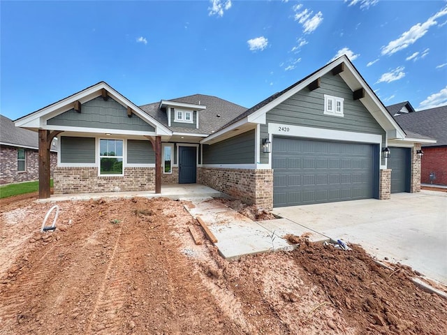 2420 Northfork Dr, Moore, OK 73160 - craftsman-style home with a garage, brick siding, and driveway