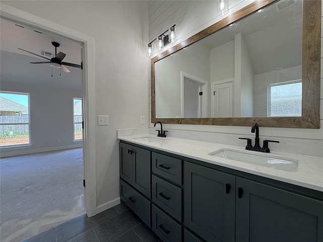 2420 Northfork Dr, Moore, OK 73160 - bathroom featuring healthy amount of natural light, baseboards, double vanity, and ceiling fan