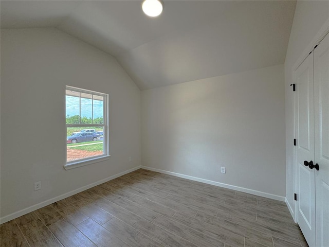 2420 Northfork Dr, Moore, OK 73160 - bonus room featuring vaulted ceiling, light wood-style floors, and baseboards