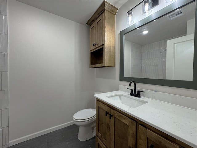 2420 Northfork Dr, Moore, OK 73160 - bathroom featuring vanity, toilet, tile patterned flooring, and baseboards