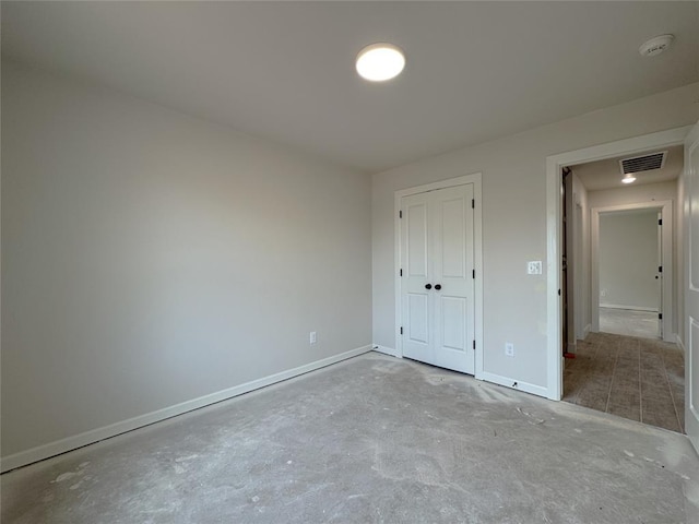 2420 Northfork Dr, Moore, OK 73160 - unfurnished bedroom with baseboards and a closet