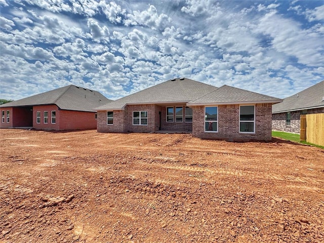 2420 Northfork Dr, Moore, OK 73160 - back of house featuring brick siding, fence, and a shingled roof