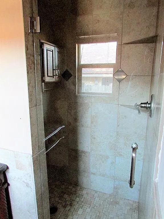 4700 NW 59th Ter, Oklahoma City, OK 73122 - full bathroom with a tile shower