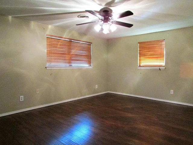 4700 NW 59th Ter, Oklahoma City, OK 73122 - unfurnished room featuring baseboards, ceiling fan, wood finished floors, and plenty of natural light
