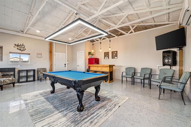 game room featuring speckled floor, a wall unit AC, billiards, and vaulted ceiling