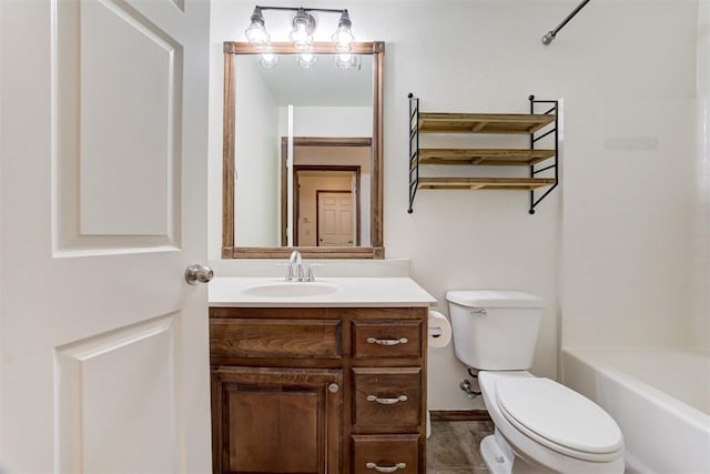 bathroom featuring toilet and vanity