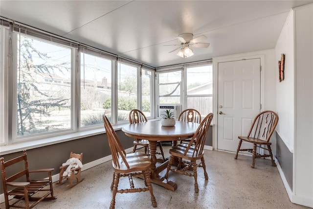 7205 N Seminole Ter, Warr Acres, OK 73132 - dining area with ceiling fan, baseboards, and light speckled floor