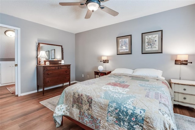 7205 N Seminole Ter, Warr Acres, OK 73132 - bedroom with baseboards, a ceiling fan, and wood finished floors