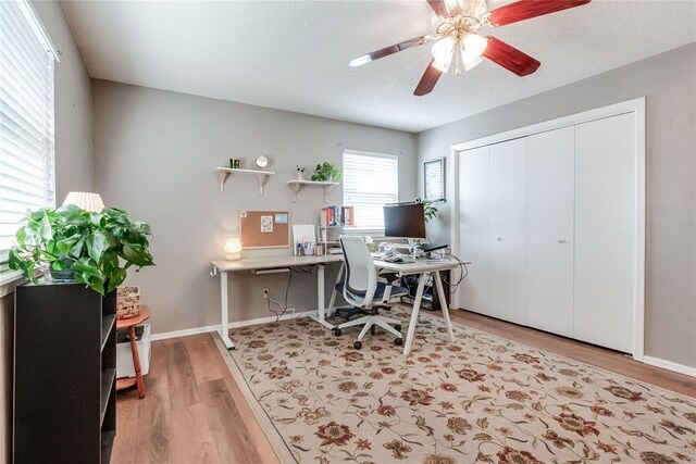 7205 N Seminole Ter, Warr Acres, OK 73132 - office with ceiling fan, light wood-type flooring, baseboards, and a textured ceiling