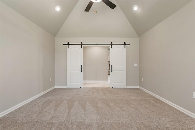 4174 Richards Way, Piedmont, OK 73078 - unfurnished bedroom with a barn door, light colored carpet, ceiling fan, high vaulted ceiling, and recessed lighting