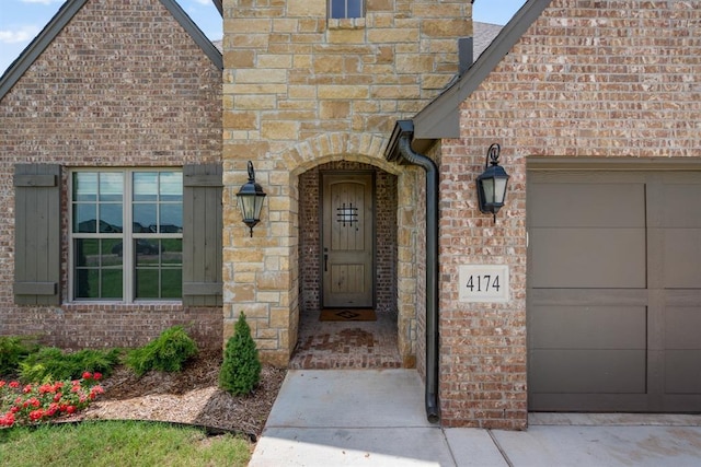 4174 Richards Way, Piedmont, OK 73078 - view of exterior entry featuring a garage and brick siding