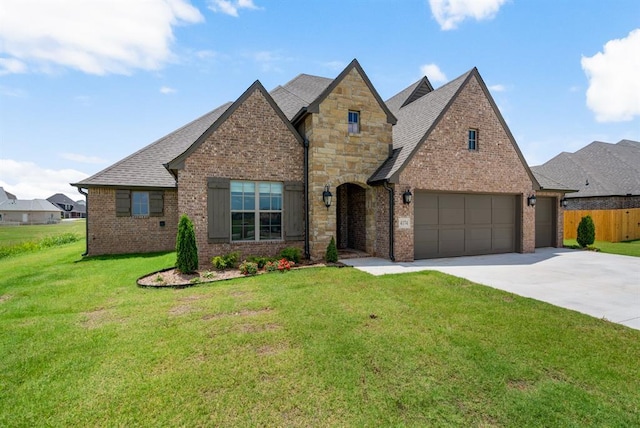 4174 Richards Way, Piedmont, OK 73078 - view of front facade with concrete driveway, brick siding, an attached garage, and roof with shingles
