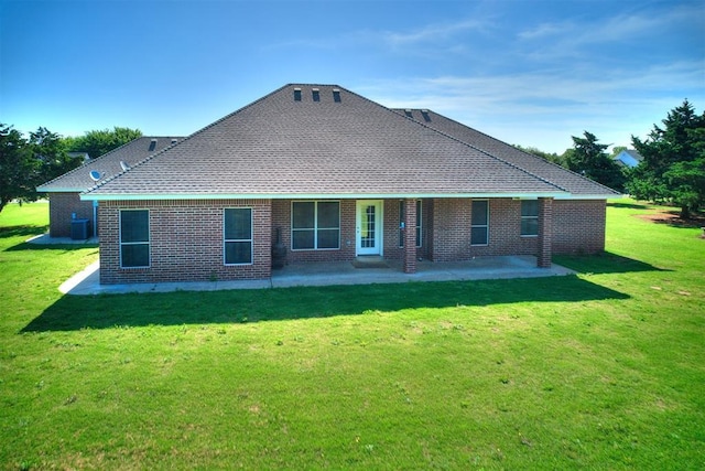 407 Heather Ln, Tuttle, OK 73089 - back of house with a patio, cooling unit, a yard, and brick siding