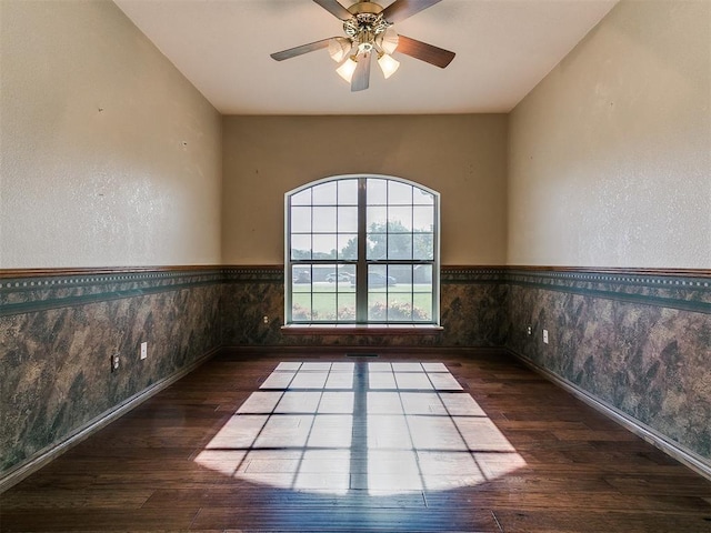 407 Heather Ln, Tuttle, OK 73089 - spare room featuring hardwood / wood-style floors, baseboards, a ceiling fan, and a wainscoted wall