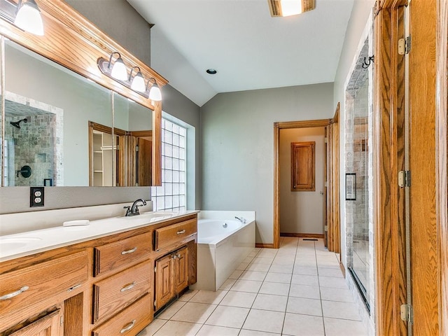 407 Heather Ln, Tuttle, OK 73089 - full bath with a stall shower, a bath, tile patterned floors, double vanity, and vaulted ceiling
